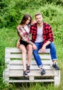 Couple relax outdoor on bench. Relations. man with girl in park. happy valentines day. summer camping in forest. family Royalty Free Stock Photo