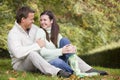 Couple relaxing in autumn woods Royalty Free Stock Photo