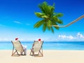 A Couple Relaxing on the Beach on a Sunny Day Royalty Free Stock Photo