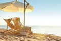 Couple relaxing on deck chairs at beach. Summer vacation Royalty Free Stock Photo