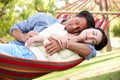 Couple Relaxing In Hammock Royalty Free Stock Photo