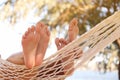 Couple relaxing in hammock on beach, closeup. Summer vacation Royalty Free Stock Photo