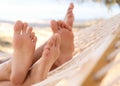 Couple relaxing in hammock on beach, closeup. Summer vacation Royalty Free Stock Photo