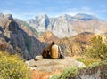 Couple relaxing on hiking trip in high mountains.