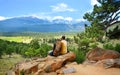 Couple relaxing on hiking trip looking at beautiful view. Royalty Free Stock Photo