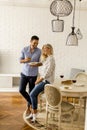 Couple relaxing at home and eating tasteful pizza