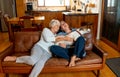 Couple relaxing at home and loving their pet. Positive image of life at home and New Normal Royalty Free Stock Photo