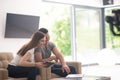 Couple relaxing at home with tablet and laptop computers Royalty Free Stock Photo