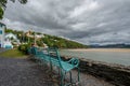 Couple relaxing on an iron bench, Portmeirion, North Wales