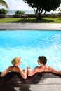 Couple relaxing in pool