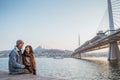 couple relaxing on the side of bosphorus during sunset Royalty Free Stock Photo