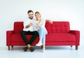 Couple relaxing on a sofa and looking movie online with tablet at home together,Happy and smiling,Free time concept Royalty Free Stock Photo