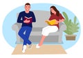 Couple relaxing in the sofa reading book