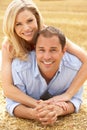 Couple Relaxing In Summer Harvested Field Royalty Free Stock Photo