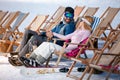 Couple relaxing together in sun at mountains Royalty Free Stock Photo