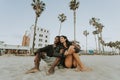 Couple relaxing at Venice Beach Royalty Free Stock Photo