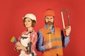 Couple is renovating home. couple doing apartment repair together themselves. man and woman wear safety helmet. couple Royalty Free Stock Photo