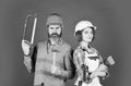 couple is renovating home. couple doing apartment repair together themselves. man and woman wear safety helmet. couple Royalty Free Stock Photo