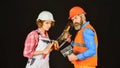 Couple renovating house. Woman builder hard hat. Man engineer or architect. Gender equality. Construction site. Quality