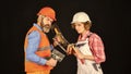 Couple renovating house. Woman builder hard hat. Man engineer or architect. Gender equality. Construction site. Quality