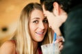 Couple in restaurant drinking milkshake Royalty Free Stock Photo