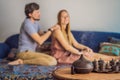 Couple resting at home. Aromatherapy Concept. Wooden Electric Ultrasonic Essential Oil Aroma Diffuser and Humidifier