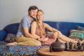 Couple resting at home. Aromatherapy Concept. Wooden Electric Ultrasonic Essential Oil Aroma Diffuser and Humidifier