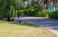 Couple resting on a lawn in park