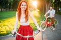 Couple on retro bicycles on sunset, romantic date