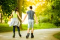 Couple ride rollerblades in the park