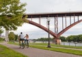 Couple riding bicycles on Mississipi riverfront in Saint Paul, Minnesota
