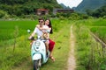 Couple riding motorbike around rice fields of Yangshuo, China Royalty Free Stock Photo