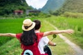 Couple riding motorbike around rice fields of Yangshuo, China Royalty Free Stock Photo