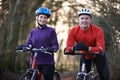 Couple Riding Mountain Bikes Through Woodlands Royalty Free Stock Photo