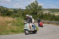Couple riding vintage scooter Vespa Royalty Free Stock Photo