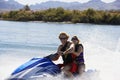 Couple Riding Water Scooter Royalty Free Stock Photo