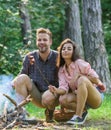 Couple roasting sausages on sticks nature background. Couple in love enjoy camping forest roasting sausage at bonfire Royalty Free Stock Photo