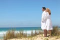 Couple in robes on ta beach Royalty Free Stock Photo