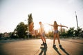 A couple roller-skating at sunset. Royalty Free Stock Photo