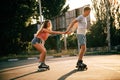 A couple roller-skating at sunset Royalty Free Stock Photo