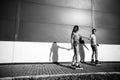 A couple roller-skating at sunset. Black and white photo Royalty Free Stock Photo