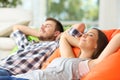 Couple or roommates relaxing at home Royalty Free Stock Photo