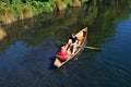 Couple Rowing row boat over Avon River Christchurch - New Zealand