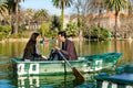 Couple rowing on small boat.