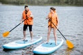 Couple rowing on the stand up paddleboard