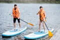 Couple rowing on the stand up paddleboard