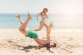 Boy falling in the beach