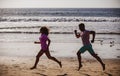 Couple running on beach. Sport and healthy lifestyle, silhouette friends jogging at sunset on the beach. Royalty Free Stock Photo