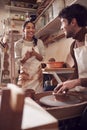 Couple Running Bespoke Pottery Business Working In Ceramics Studio Together Royalty Free Stock Photo