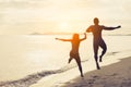 Couple running enjoy life playing and freedom beach at sunset Royalty Free Stock Photo